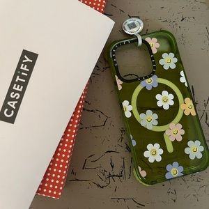 Casetify 14 Pro iPhone Cutest Green with Smiley Daisy Print case